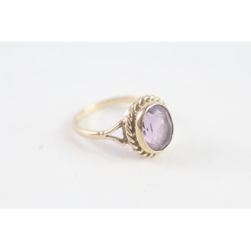 115 - A 9CT GOLD VINTAGE AMETHYST DRESS RING Weight: 3.2 gms