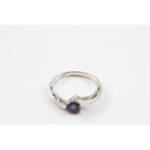 120 - A 9CT WHITE GOLD TRILLIANT CUT IOLITE DRESS RING Weight: 2.7gms