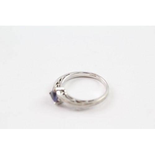 120 - A 9CT WHITE GOLD TRILLIANT CUT IOLITE DRESS RING Weight: 2.7gms