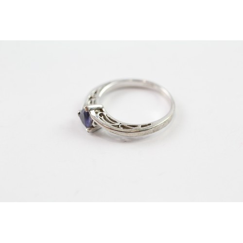 120 - A 9CT WHITE GOLD TRILLIANT CUT IOLITE DRESS RING Weight: 2.7gms