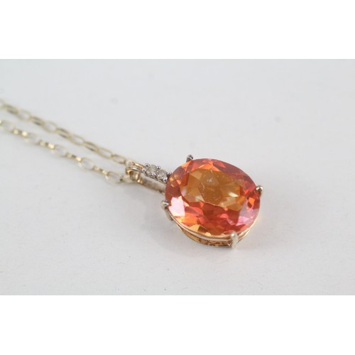 119 - A 9CT GOLD DIAMOND AND MYSTIC TOPAZ PENDANT NECKLACE Weight: 2.6gms