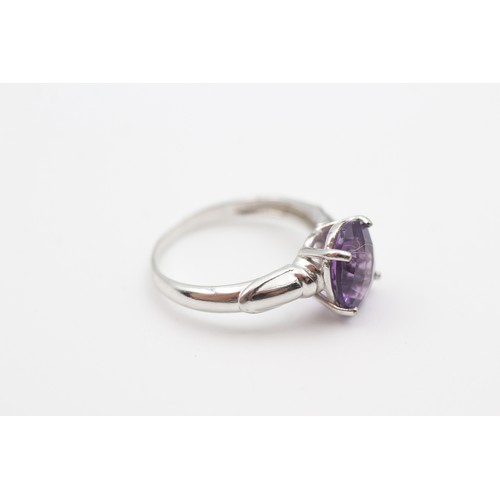 122 - A 9CT WHITE GOLD AMETHYST SINGLE STONE RING Weight: 3.1gms