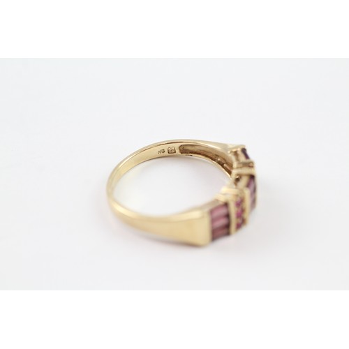 126 - A 9CT GOLD RUBY AND GARNET DRESS RING Weight: 3.2gms