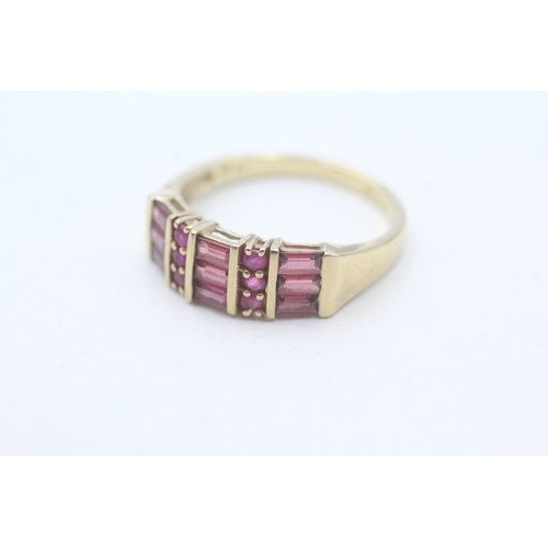 126 - A 9CT GOLD RUBY AND GARNET DRESS RING Weight: 3.2gms