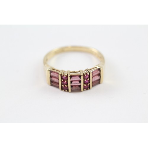 126 - A 9CT GOLD RUBY AND GARNET DRESS RING Weight: 3.2gms