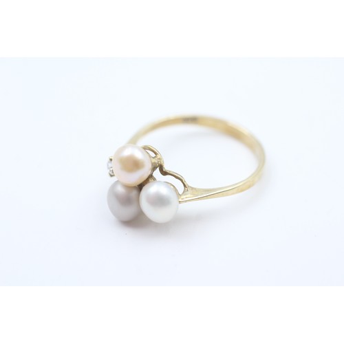 144 - A 9CT GOLD CULTURED PEARL AND CUBIC ZIRCONIA DRESS RING Weight: 2.2gms