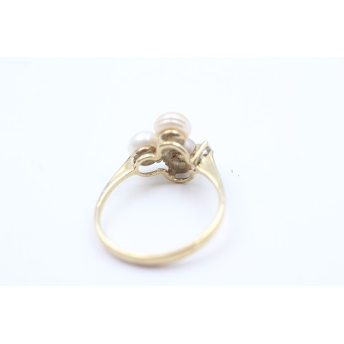 144 - A 9CT GOLD CULTURED PEARL AND CUBIC ZIRCONIA DRESS RING Weight: 2.2gms