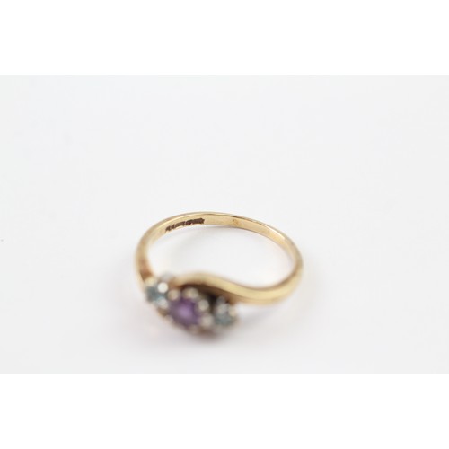 145 - A 9CT GOLD VINTAGE AMETHYST AND BLUE GEMSTONE DRESS RING Weight: 2.2gms