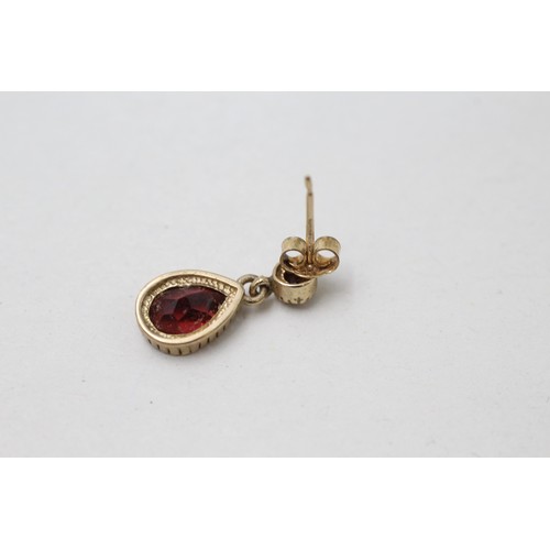 153 - A PAIR OF 9CT GOLD GARNET TEAR DROP EARRINGS Weight: 1.7gms