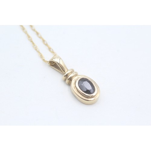 155 - A 9CT GOLD OVAL CUT SAPPHIRE PENDANT NECKLACE Weight: 1.9gms