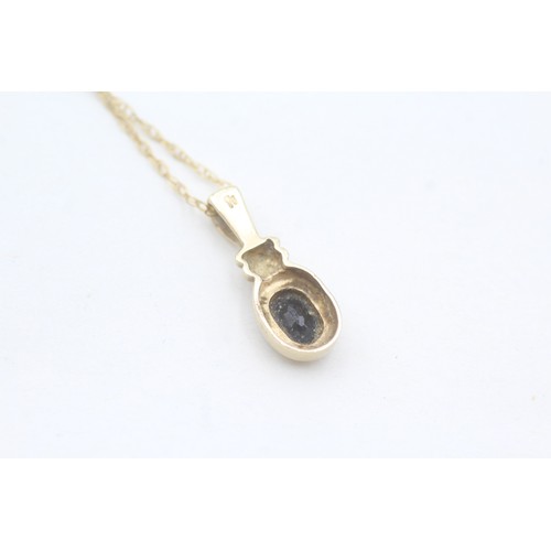 155 - A 9CT GOLD OVAL CUT SAPPHIRE PENDANT NECKLACE Weight: 1.9gms