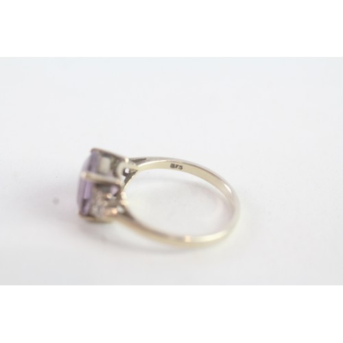 163 - A 9CT GOLD AMETHYST AND DIAMOND DRESS RING Weight: 2 gms