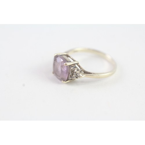 163 - A 9CT GOLD AMETHYST AND DIAMOND DRESS RING Weight: 2 gms