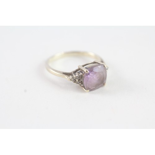 163 - A 9CT GOLD AMETHYST AND DIAMOND DRESS RING Weight: 2 gms