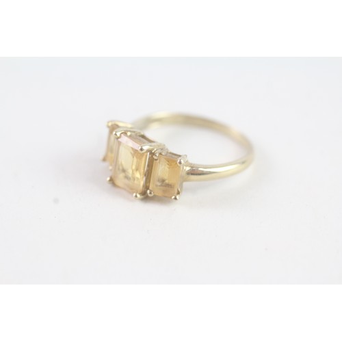 165 - A 9CT GOLD CITRINE TRILOGY RING Weight: 2.3 gms