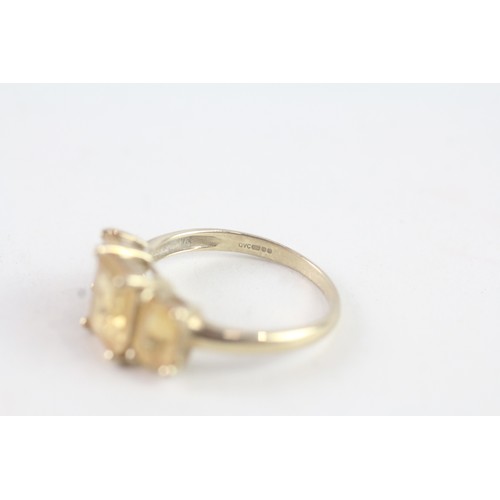 165 - A 9CT GOLD CITRINE TRILOGY RING Weight: 2.3 gms