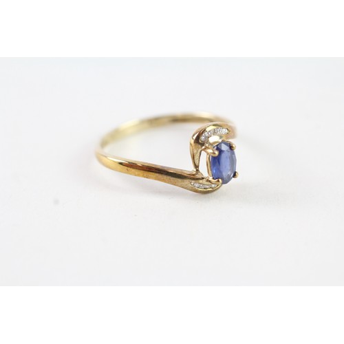 162 - A 9CT GOLD OVAL BLUE GEMSTONE AND DIAMOND DRESS RING Weight: 1.7 gms