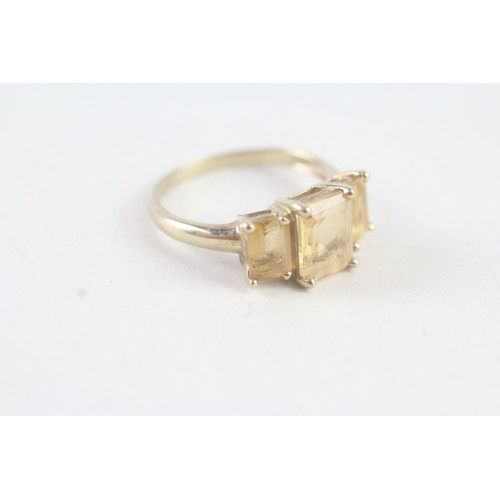 165 - A 9CT GOLD CITRINE TRILOGY RING Weight: 2.3 gms