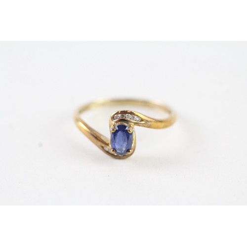 162 - A 9CT GOLD OVAL BLUE GEMSTONE AND DIAMOND DRESS RING Weight: 1.7 gms