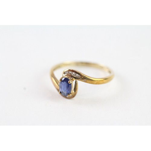 162 - A 9CT GOLD OVAL BLUE GEMSTONE AND DIAMOND DRESS RING Weight: 1.7 gms