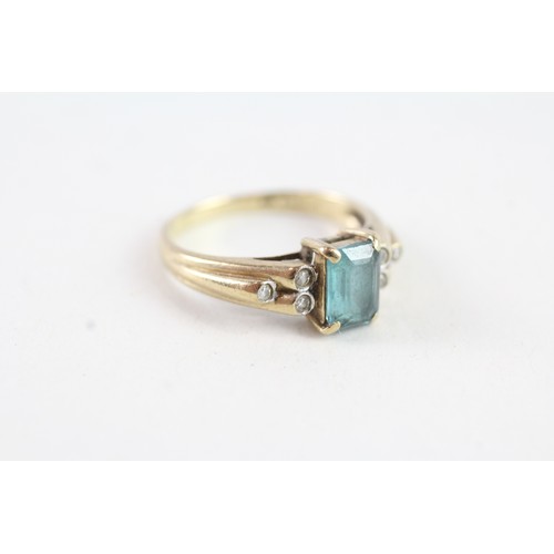 136 - A 9CT GOLD BLUE TOPAZ AND DIAMOND DRESS RING Weight: 2.4 gms