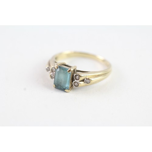 136 - A 9CT GOLD BLUE TOPAZ AND DIAMOND DRESS RING Weight: 2.4 gms