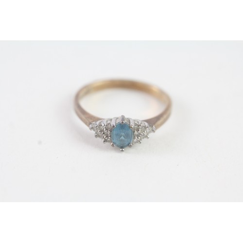 141 - A 9CT GOLD BLUE TOPAZ AND DIAMOND DRESS RING Weight: 2.4 gms