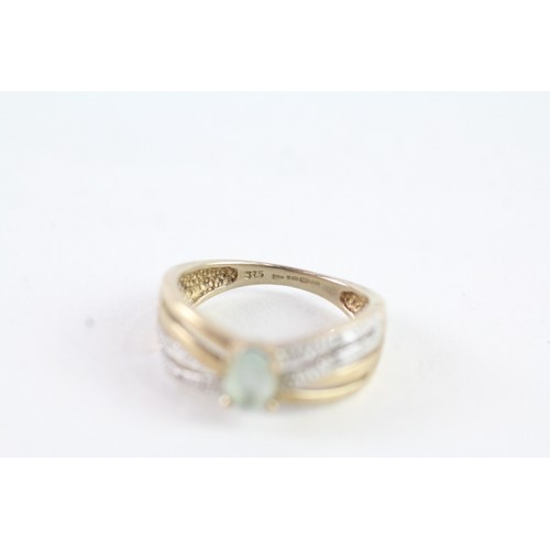 138 - A 9 CT GOLD BLUE GEMSTONE AND DIAMOND DRESS RING Weight: 2.8 gms