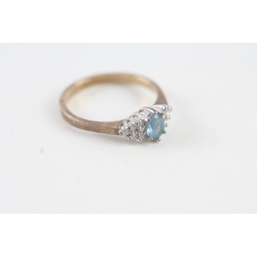 141 - A 9CT GOLD BLUE TOPAZ AND DIAMOND DRESS RING Weight: 2.4 gms