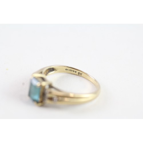 136 - A 9CT GOLD BLUE TOPAZ AND DIAMOND DRESS RING Weight: 2.4 gms