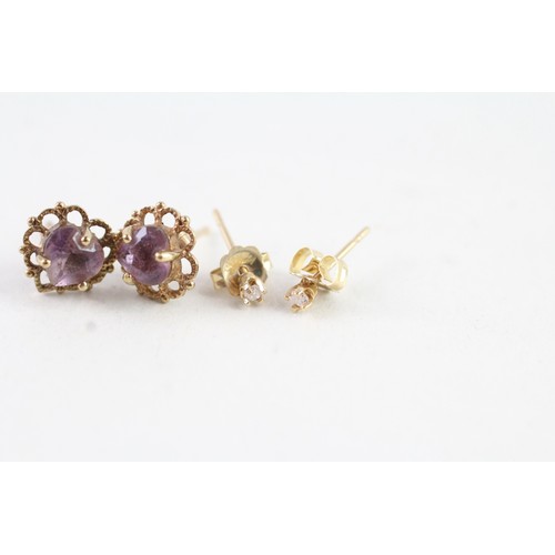 176 - TWO PAIRS OF 9CT GOLD AMETHYST AND DIAMOND STUD EARRINGS (2) Weight: 1.4 gms