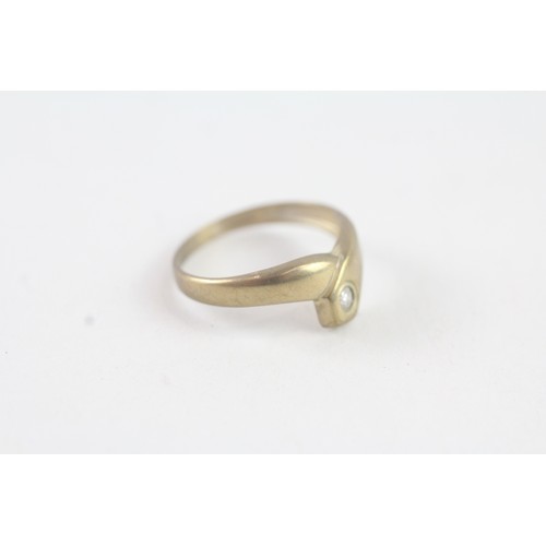 183 - A 9CT GOLD BEZEL SET DIAMOND DRESS RING Weight: 0.8 gms