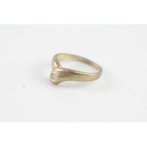 183 - A 9CT GOLD BEZEL SET DIAMOND DRESS RING Weight: 0.8 gms