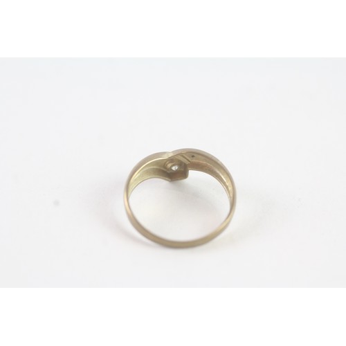 183 - A 9CT GOLD BEZEL SET DIAMOND DRESS RING Weight: 0.8 gms