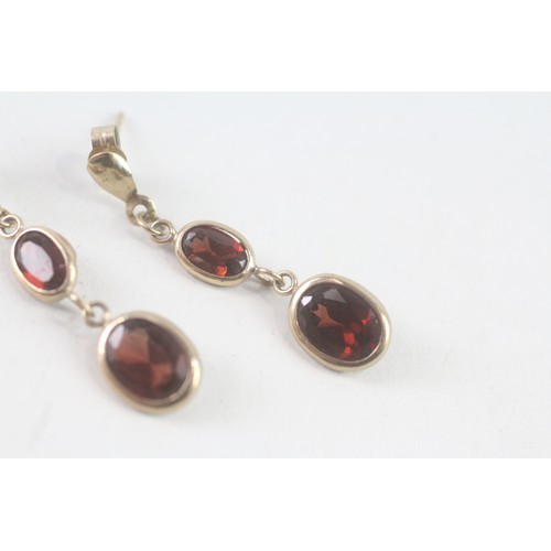 181 - A PAIR OF 9CT GOLD GARNET DROP EARRINGS Weight: 1.4 gms