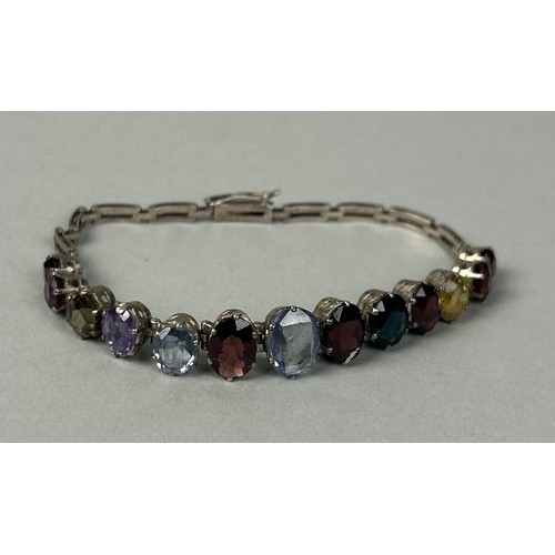 216 - A SILVER BRACELET SET WITH COLOURED STONES Weight: 13.8gms