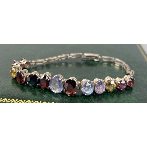 216 - A SILVER BRACELET SET WITH COLOURED STONES Weight: 13.8gms