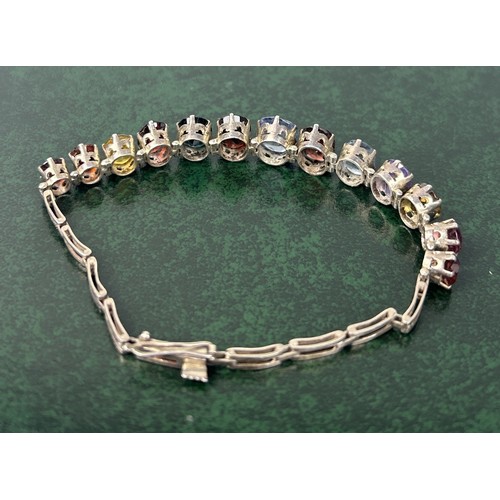 216 - A SILVER BRACELET SET WITH COLOURED STONES Weight: 13.8gms