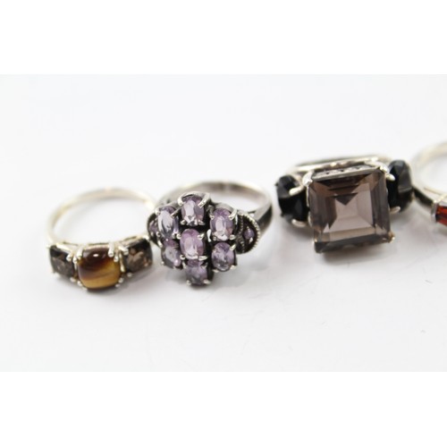 233 - AN ASSORTMENT OF SILVER GEMSTONE RINGS INC. GARNET, SMOKEY QUARTZ, PERIDOT (6) Weight: 35gms