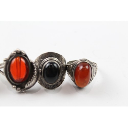 235 - A COLLECTION OF STERLING SILVER GEMSTONE RINGS INCLUDING ONYX AND SMOKY QUARTZ