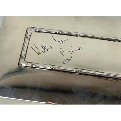 254 - A STERLING SILVER CIGARETTE BOX SIGNED TO TOP BY BING CROSBY Signed 'With love, Bing'. Wood lined in... 