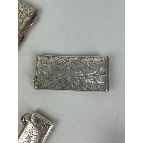 276 - FIVE SILVER VESTA CASES / CIGARETTE CASES Total weight:150gms Four with chased foliate design.