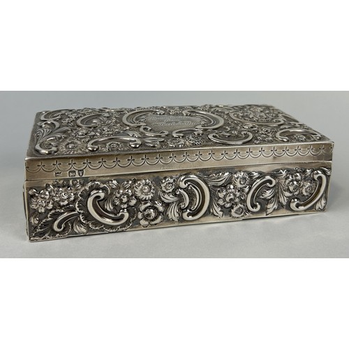 281 - A SILVER CIGARETTE BOX WITH FLORAL REPOUSSE DESIGN 18cm x 9cm x 5cm