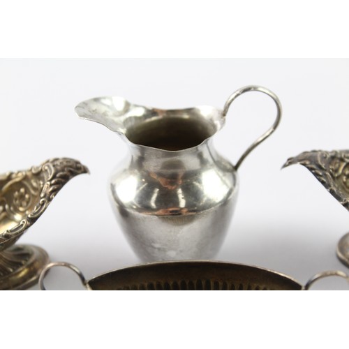 324 - FOUR .925 STERLING SILVER CONDIMENT DISHES AND CREAM JUG (4)

Weight: 83gms