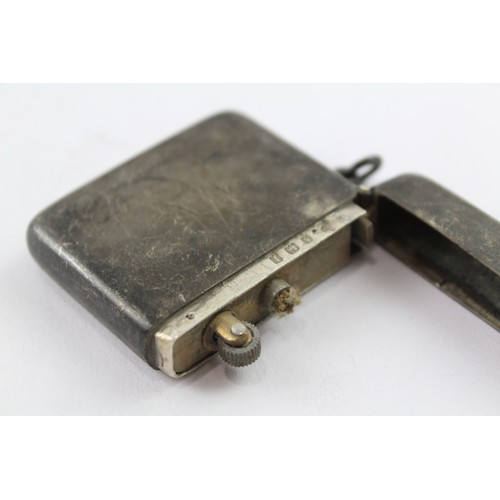 358 - A .925 STERLING SILVER PETROL CIGARETTE LIGHTER

Weight: 52gms