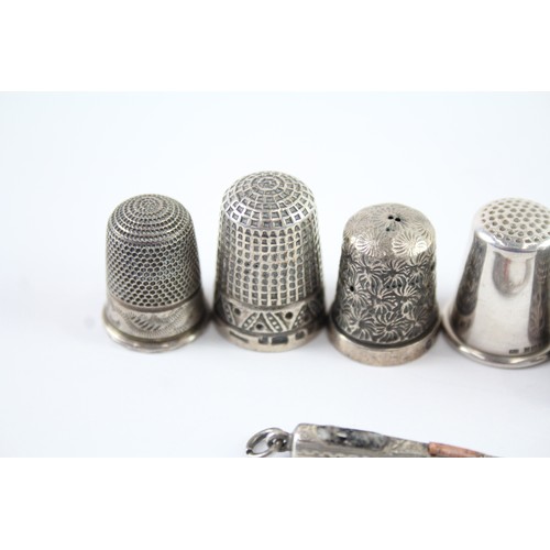 409 - EIGHT .925 STERLING SILVER THIMBLES AND SMALL BUTTON HOOK INCLUDING CHARLES HOLDER

Weight: 42gms