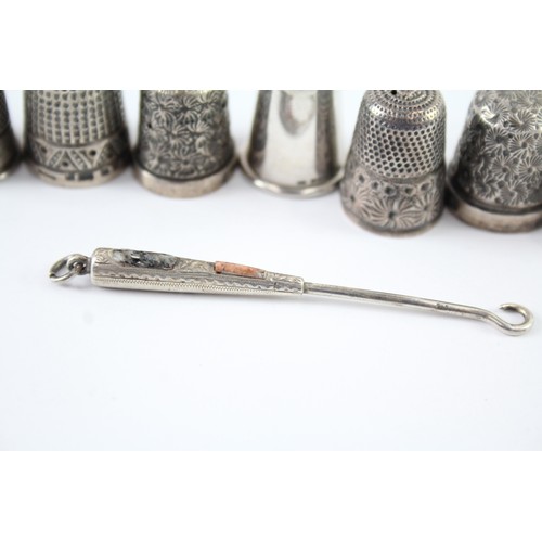 409 - EIGHT .925 STERLING SILVER THIMBLES AND SMALL BUTTON HOOK INCLUDING CHARLES HOLDER

Weight: 42gms