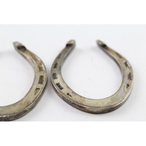 420 - TWO .925 STERLING SILVER NOVELTY LUCKY HORSESHOES (2)

Weight: 66gms