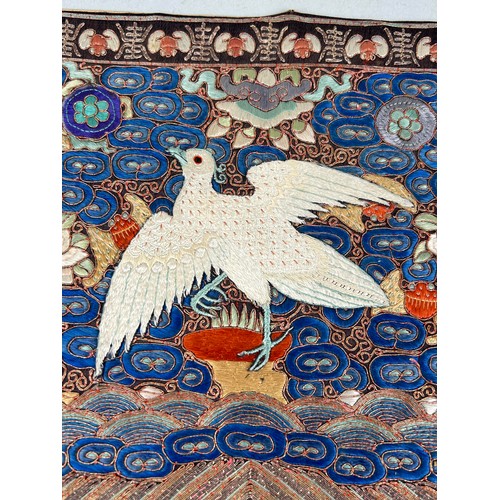 588 - A CHINESE SILK EMBROIDERED RANK BADGE WITH AN EGRET 28cm x 28cm