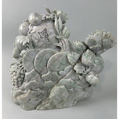 600 - A LARGE CHINESE JADE SCULPTURE DEPICTING FIGURES WITH FRUIT AND FOLIAGE 43cm x 43cm